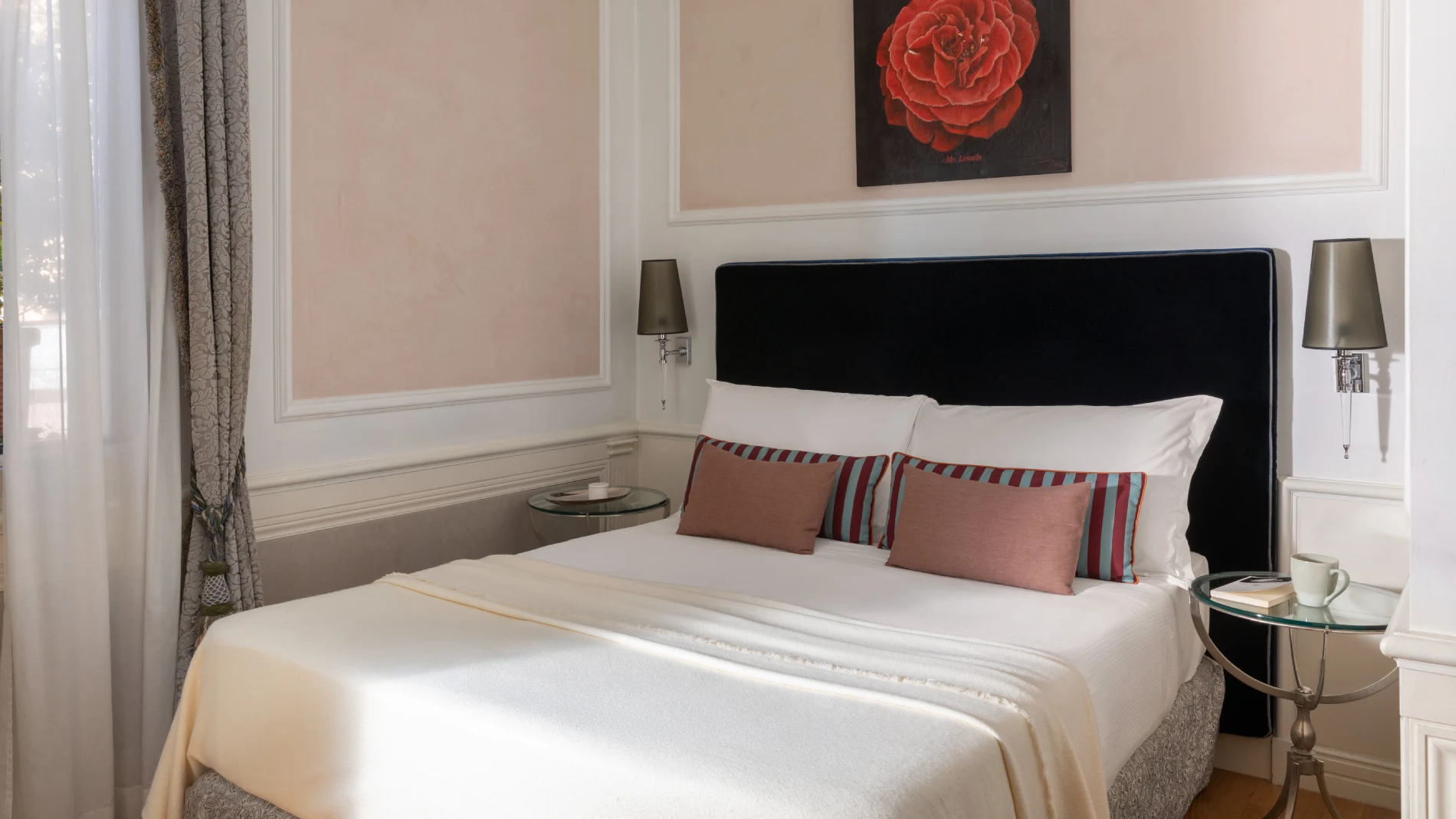 Room with double bed, black headboard, pink cushions and floral artwork near Piazza della Repubblica - The Hotel Britannia, BZAR hotels in Rome