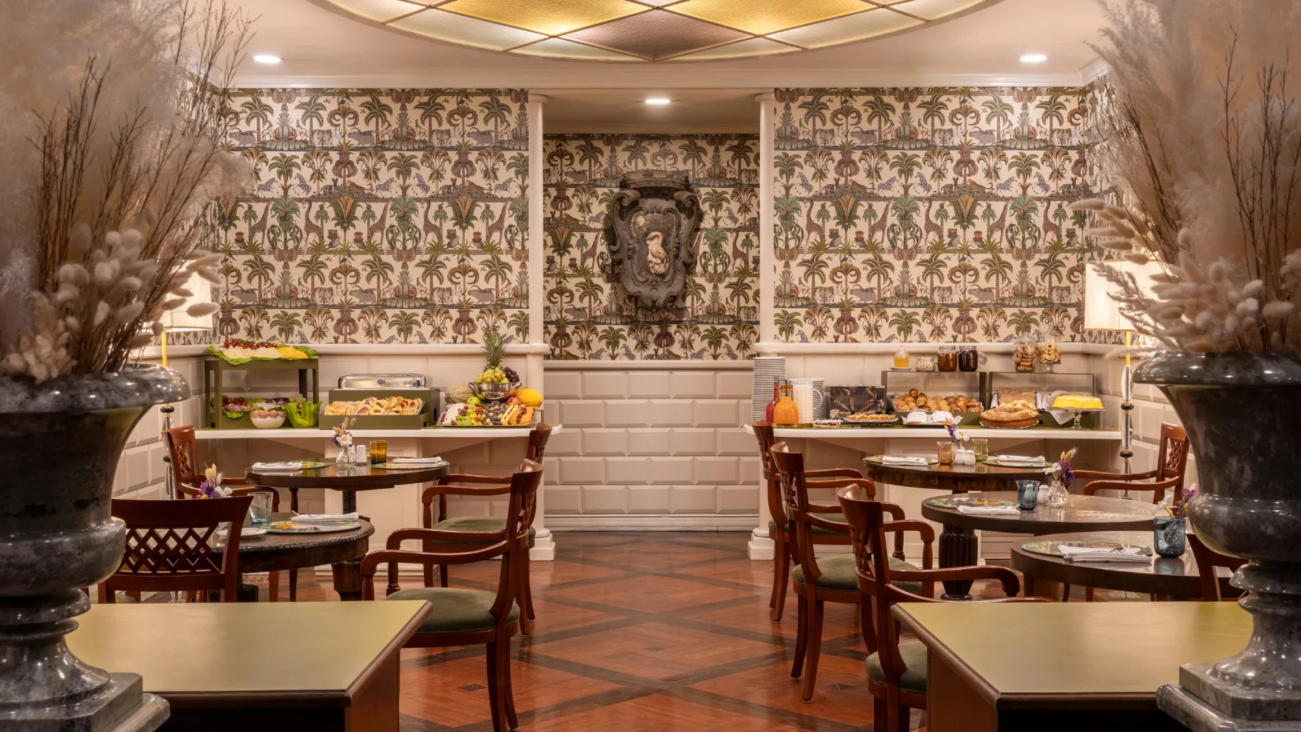 Spacious breakfast room with buffet, set tables and tropical wallpaper near Santa Maria Maggiore - The Hotel Britannia, BZAR hotels in Rome